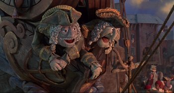 Movie still from “Muppet Treasure Island” (1996), directed by David Lane – A couple of puppets that are next to each other; Medium shot, Low angle
