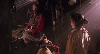 Movie still from “Muppet Treasure Island” (1996), directed by David Lane – A group of people standing next to each other in a room; Medium shot, Over the shoulder angle