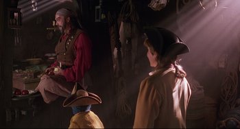 Movie still from “Muppet Treasure Island” (1996), directed by David Lane – A man and a woman dressed as pirates in a room; Medium shot, Over the shoulder angle