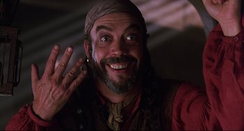 Movie still from “Muppet Treasure Island” (1996), directed by David Lane – A person with a beard wearing a hat; Close Up shot, Low angle
