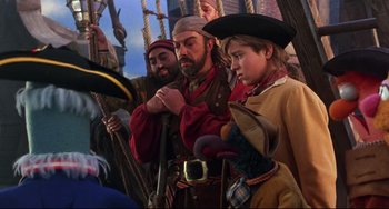 Movie still from “Muppet Treasure Island” (1996), directed by David Lane – A group of people dressed as pirates on a boat; Medium shot, Over the shoulder angle