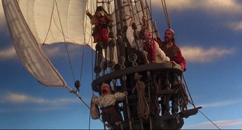 Movie still from “Muppet Treasure Island” (1996), directed by David Lane – A group of people sitting on top of a boat; Wide shot, Low angle