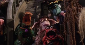 Movie still from “Muppet Treasure Island” (1996), directed by David Lane – A group of three muppets standing next to each other; Medium shot, High angle