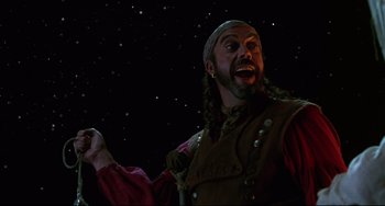 Movie still from “Muppet Treasure Island” (1996), directed by David Lane – A man with a long beard and a hat on; Medium shot, Low angle