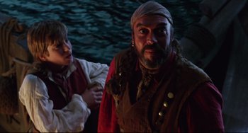 Movie still from “Muppet Treasure Island” (1996), directed by David Lane – A man in a pirate costume and a woman in a pirate costume; Medium shot, Over the shoulder angle