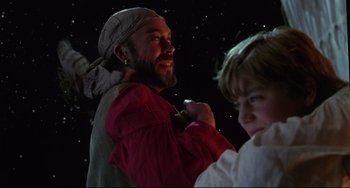 Movie still from “Muppet Treasure Island” (1996), directed by David Lane – A man and a boy are standing in front of a star filled night sky; Medium shot, Over the shoulder angle