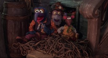 Movie still from “Muppet Treasure Island” (1996), directed by David Lane – A group of stuffed animals sitting on top of a pile of rope; Wide shot, High angle