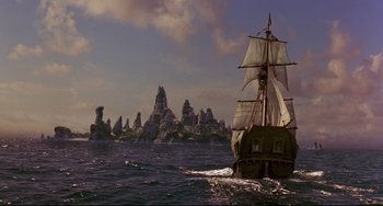 Movie still from “Muppet Treasure Island” (1996), directed by David Lane – An old pirate ship in the water; Extreme Wide shot, Low angle