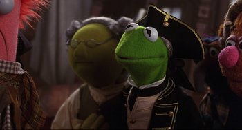Movie still from “Muppet Treasure Island” (1996), directed by David Lane – A couple of people that are dressed up; Close Up shot, Low angle