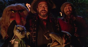 Movie still from “Muppet Treasure Island” (1996), directed by David Lane – A group of people dressed up as pirates; Medium shot, High angle