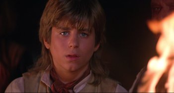 Movie still from “Muppet Treasure Island” (1996), directed by David Lane – A young man with long hair and a red neck tie; Close Up shot, Over the shoulder angle
