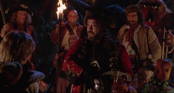 Movie still from “Muppet Treasure Island” (1996), directed by David Lane – A group of people dressed as pirates; Medium shot, Over the shoulder angle