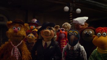 Movie still from “Muppets Most Wanted” (2014), directed by James Bobin – A group of people dressed up as muppets; Medium shot, High angle