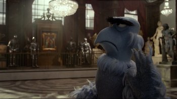 Movie still from “Muppets Most Wanted” (2014), directed by James Bobin – A stuffed animal in a room; Medium shot, Over the shoulder angle