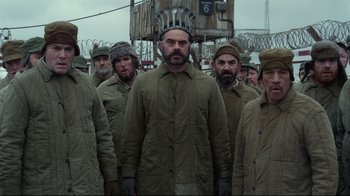 Movie still from “Muppets Most Wanted” (2014), directed by James Bobin – A group of men standing next to each other; Medium shot, Low angle