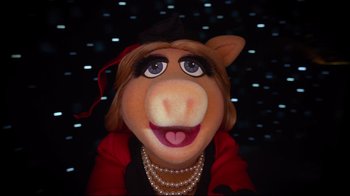 Movie still from “Muppets Most Wanted” (2014), directed by James Bobin – The face of a woman dressed as a muppet; Close Up shot, High angle