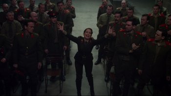 Movie still from “Muppets Most Wanted” (2014), directed by James Bobin – A group of people standing in a room; Wide shot, Low angle