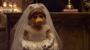 Movie still from “Muppets Most Wanted” (2014), directed by James Bobin – A stuffed animal wearing a wedding dress and a tiara; Close Up shot, High angle
