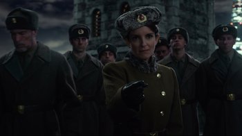 Movie still from “Muppets Most Wanted” (2014), directed by James Bobin – A group of men in military uniforms stand in front of a building; Medium shot, Low angle