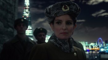Movie still from “Muppets Most Wanted” (2014), directed by James Bobin – A woman in a military uniform and a hat; Close Up shot, Over the shoulder angle