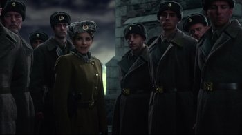 Movie still from “Muppets Most Wanted” (2014), directed by James Bobin – A group of men and women dressed in military uniforms; Medium shot, Low angle