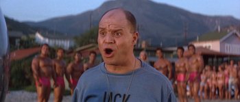 Movie still from “Muscle Beach Party” (1964), directed by William Asher – A bald man with a surprised look on his face; Close Up shot, Low angle