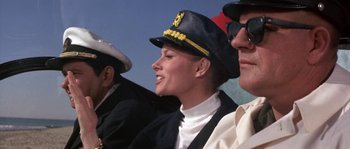 Movie still from “Muscle Beach Party” (1964), directed by William Asher – A woman wearing a sailor's hat and a white shirt; Medium shot, Low angle