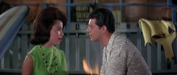 Movie still from “Muscle Beach Party” (1964), directed by William Asher – A man and a woman talking to each other; Close Up shot, Over the shoulder angle