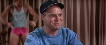 Movie still from “Muscle Beach Party” (1964), directed by William Asher – A person wearing a hat and smiling; Close Up shot, Low angle