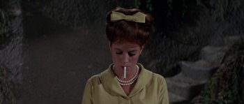 Movie still from “Muscle Beach Party” (1964), directed by William Asher – A woman with a cigarette in her mouth; Close Up shot, High angle