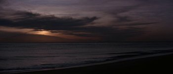 Movie still from “Muscle Beach Party” (1964), directed by William Asher – A dark sky over a body of water; Extreme Wide shot, Low angle