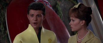 Movie still from “Muscle Beach Party” (1964), directed by William Asher – A man and a woman wearing yellow jackets; Close Up shot, Low angle