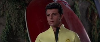 Movie still from “Muscle Beach Party” (1964), directed by William Asher – A man in a yellow and black jacket; Close Up shot, Low angle