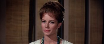 Movie still from “Muscle Beach Party” (1964), directed by William Asher – A person wearing a necklace; Close Up shot, Low angle