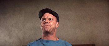 Movie still from “Muscle Beach Party” (1964), directed by William Asher – A person wearing a hat; Close Up shot, Low angle