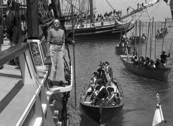 Movie still from “Mutiny on the Bounty” (1935), directed by Frank Lloyd – A group of people on a boat in the water; Wide shot, High angle