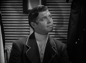 Movie still from “Mutiny on the Bounty” (1935), directed by Frank Lloyd – Black and white photograph of a man looking up; Close Up shot, Over the shoulder angle