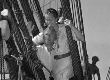 Movie still from “Mutiny on the Bounty” (1935), directed by Frank Lloyd – Two people on a boat in the water; Medium shot, High angle