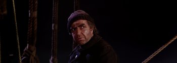 Movie still from “Mutiny on the Bounty” (1962), directed by George Seaton – A person wearing a hat; Close Up shot, Low angle