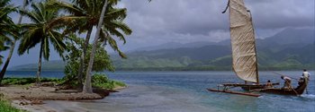 Movie still from “Mutiny on the Bounty” (1962), directed by George Seaton – A body of water near a lush green forest; Extreme Wide shot, High angle