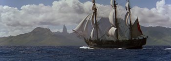 Movie still from “Mutiny on the Bounty” (1962), directed by George Seaton – An image of a boat in the water; Extreme Wide shot, Low angle