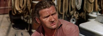 Movie still from “Mutiny on the Bounty” (1962), directed by George Seaton – A person with long hair; Close Up shot, High angle
