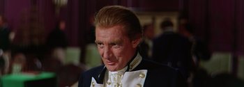 Movie still from “Mutiny on the Bounty” (1962), directed by George Seaton – A person wearing a suit and tie; Close Up shot, High angle