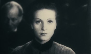 Movie still from “My American Uncle” (1980), directed by Alain Resnais – A black and white photo of a woman's face; Close Up shot, High angle