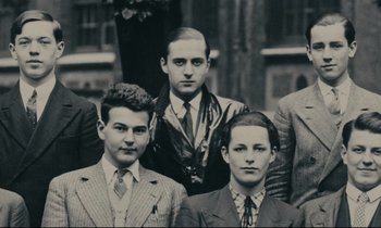 Movie still from “My American Uncle” (1980), directed by Alain Resnais – A black and white photo of a group of young men; Medium shot, Low angle