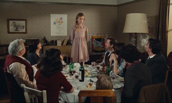 Movie still from “My American Uncle” (1980), directed by Alain Resnais – A group of people sitting around a dinner table; Wide shot, High angle