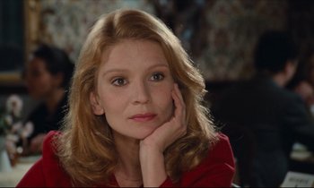 Movie still from “My American Uncle” (1980), directed by Alain Resnais – A beautiful woman sitting in front of a mirror; Close Up shot, Low angle