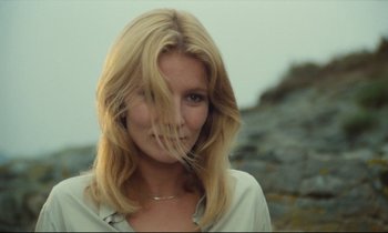 Movie still from “My American Uncle” (1980), directed by Alain Resnais – A beautiful blond woman with a long , blonde hair style; Close Up shot, Low angle