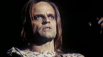 Movie still from “My Best Fiend” (1999), directed by Werner Herzog – A person with long brown hair; Close Up shot, Low angle