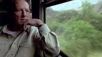 Movie still from “My Best Fiend” (1999), directed by Werner Herzog – A man sitting on a train looking out the window; Close Up shot, Low angle